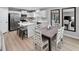 Open concept kitchen with dining area, center island with barstool seating and stainless appliances at 164 Clove Hitch Ln, Fuquay Varina, NC 27526
