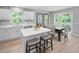 Open concept kitchen and dining area with center island and stainless appliances at 164 Clove Hitch Ln, Fuquay Varina, NC 27526