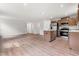 Modern kitchen with stainless steel appliances, granite counters, wood cabinets and open floor plan at 164 Clove Hitch Ln, Fuquay Varina, NC 27526