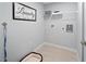 Functional laundry room with a washer hookup, open shelving, and stylish decor at 164 Clove Hitch Ln, Fuquay Varina, NC 27526