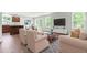 Bright and airy living room open to the kitchen with hardwood floors and lots of natural light at 164 Clove Hitch Ln, Fuquay Varina, NC 27526