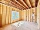 Unfinished bathroom with plumbing fixtures and a window for natural light at 508 Northwood Dr, Raleigh, NC 27609