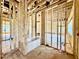 Bathroom framing showcasing a new bathtub, exposed pipes and wiring at 508 Northwood Dr, Raleigh, NC 27609