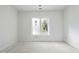 A bright bedroom featuring a large window that fills the space with natural light, creating a warm and inviting atmosphere at 508 Northwood Dr, Raleigh, NC 27609