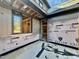 Exterior view of under-construction home with dark trim windows and siding material, offering a glimpse of backyard at 508 Northwood Dr, Raleigh, NC 27609
