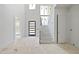 New construction foyer featuring stairs, a door, and a hallway at 508 Northwood Dr, Raleigh, NC 27609