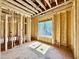 View of new construction with wood framing and a window overlooking neighborhood homes at 508 Northwood Dr, Raleigh, NC 27609