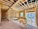 Unfinished hallway with natural light and open views of the surrounding construction at 508 Northwood Dr, Raleigh, NC 27609