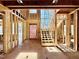 The home's interior framing showcases a staircase and abundant natural light from large windows at 508 Northwood Dr, Raleigh, NC 27609