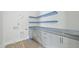 Bright laundry room under construction featuring new cabinets and shelving at 508 Northwood Dr, Raleigh, NC 27609