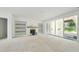 Living room boasting natural light with a fireplace and built-in shelves, with outdoor access at 508 Northwood Dr, Raleigh, NC 27609
