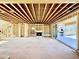 Unfinished living room with fireplace and sliding glass doors leading to the backyard at 508 Northwood Dr, Raleigh, NC 27609