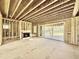 Unfinished living room with fireplace and sliding glass doors, in the process of being built at 508 Northwood Dr, Raleigh, NC 27609