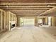 Unfinished living room with fireplace and large sliding glass doors to outdoor space at 508 Northwood Dr, Raleigh, NC 27609