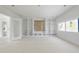 Bright living room featuring built-in shelving and a large window, perfect for relaxation and entertaining at 508 Northwood Dr, Raleigh, NC 27609