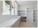 Bright breakfast nook area with built in shelves and a view outside at 508 Northwood Dr, Raleigh, NC 27609