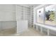 Spacious walk-in closet features custom shelving, drawers, and a window seat, providing ample storage and natural light at 508 Northwood Dr, Raleigh, NC 27609
