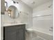 Bright bathroom featuring a vanity with modern finishes, an updated toilet, and a bathtub with white walls at 130 S Estes Dr # B7, Chapel Hill, NC 27514