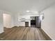 Bright kitchen featuring a stainless steel appliances, hardwood floors, white cabinets, and a bright window at 130 S Estes Dr # B7, Chapel Hill, NC 27514