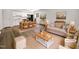 Bright living room showcasing an open layout with hardwood floors, neutral furniture, and an eat-in kitchen with stainless steel appliances at 130 S Estes Dr # B7, Chapel Hill, NC 27514