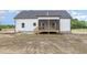 Exterior view of the home's backyard with screened-in porch at 7327 Shawan Rd, Wendell, NC 27591