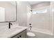 A stylish bathroom boasts a tiled shower with a window, a bathtub, and a modern vanity at 7327 Shawan Rd, Wendell, NC 27591