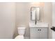 A modern bathroom offers a sleek vanity with matte black hardware and a stylish mirror at 7327 Shawan Rd, Wendell, NC 27591