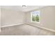 Neutral bedroom with a window providing lots of natural light at 7327 Shawan Rd, Wendell, NC 27591