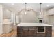 Elegant kitchen island with marble countertops, modern appliances, and ample storage, great for entertaining at 7327 Shawan Rd, Wendell, NC 27591