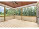 Cozy screened-in porch with wood flooring and wooded views at 7327 Shawan Rd, Wendell, NC 27591