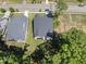 Aerial view showcasing the roof and lot of a home surrounded by mature trees at 5305 Dixon Dr, Raleigh, NC 27609