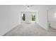 Bright bedroom features plush carpet, a ceiling fan, and plenty of natural light from dual windows at 5305 Dixon Dr, Raleigh, NC 27609