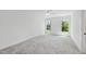 Bright, spacious bedroom with plush carpeting and large windows providing ample natural light at 5305 Dixon Dr, Raleigh, NC 27609