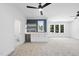 Spacious bonus room with wet bar, wine fridge, blue tiled backsplash and plush carpeting at 5305 Dixon Dr, Raleigh, NC 27609