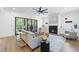 Cozy living room with a fireplace, neutral tones, and access to an outdoor patio with a fireplace at 5305 Dixon Dr, Raleigh, NC 27609