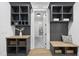 Organized mudroom with built-in shelves, storage, and a comfortable bench at 5305 Dixon Dr, Raleigh, NC 27609