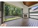 Relaxing screened-in patio with a beautiful wood burning fireplace and backyard views at 5305 Dixon Dr, Raleigh, NC 27609