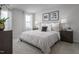 Well-lit bedroom featuring plush carpet, neutral walls, and modern decor at 356 N Coral Bells Way Way, Four Oaks, NC 27524