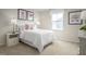 Comfortable bedroom featuring plush carpet, neutral tones, and plenty of natural light at 356 N Coral Bells Way Way, Four Oaks, NC 27524
