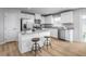 Bright kitchen with stainless steel appliances, a center island, and ample cabinet space for storage at 356 N Coral Bells Way Way, Four Oaks, NC 27524