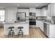 Well-equipped kitchen with stainless steel appliances and a granite island with seating at 356 N Coral Bells Way Way, Four Oaks, NC 27524