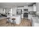 Modern kitchen featuring stainless steel appliances and island with seating at 356 N Coral Bells Way Way, Four Oaks, NC 27524