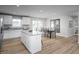 Open-concept kitchen and dining area with a center island and stainless steel appliances at 356 N Coral Bells Way Way, Four Oaks, NC 27524