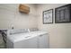 Practical laundry room with modern washer and dryer, storage, and stylish decor at 356 N Coral Bells Way Way, Four Oaks, NC 27524