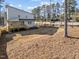 Expansive backyard with a wooden deck, perfect for outdoor living at 100 Farris Ct, Raleigh, NC 27610