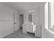Bathroom featuring single vanity and decorative mirror at 100 Farris Ct, Raleigh, NC 27610