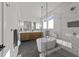 Spacious bathroom featuring double vanity, modern tub, and glass shower with tile surround at 100 Farris Ct, Raleigh, NC 27610