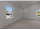 Bright, airy bedroom featuring large windows and a modern ceiling fan at 100 Farris Ct, Raleigh, NC 27610