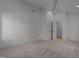 Minimalist bedroom with neutral carpet, ceiling fan, and ample space at 100 Farris Ct, Raleigh, NC 27610