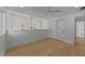 Modern bedroom with high ceilings, hardwood floors, fan, and natural light at 100 Farris Ct, Raleigh, NC 27610